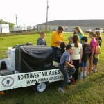 Trevor shows the group the NWMO ARES QSL card album.